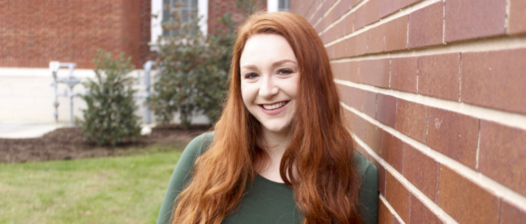 A person smiles for the camera.